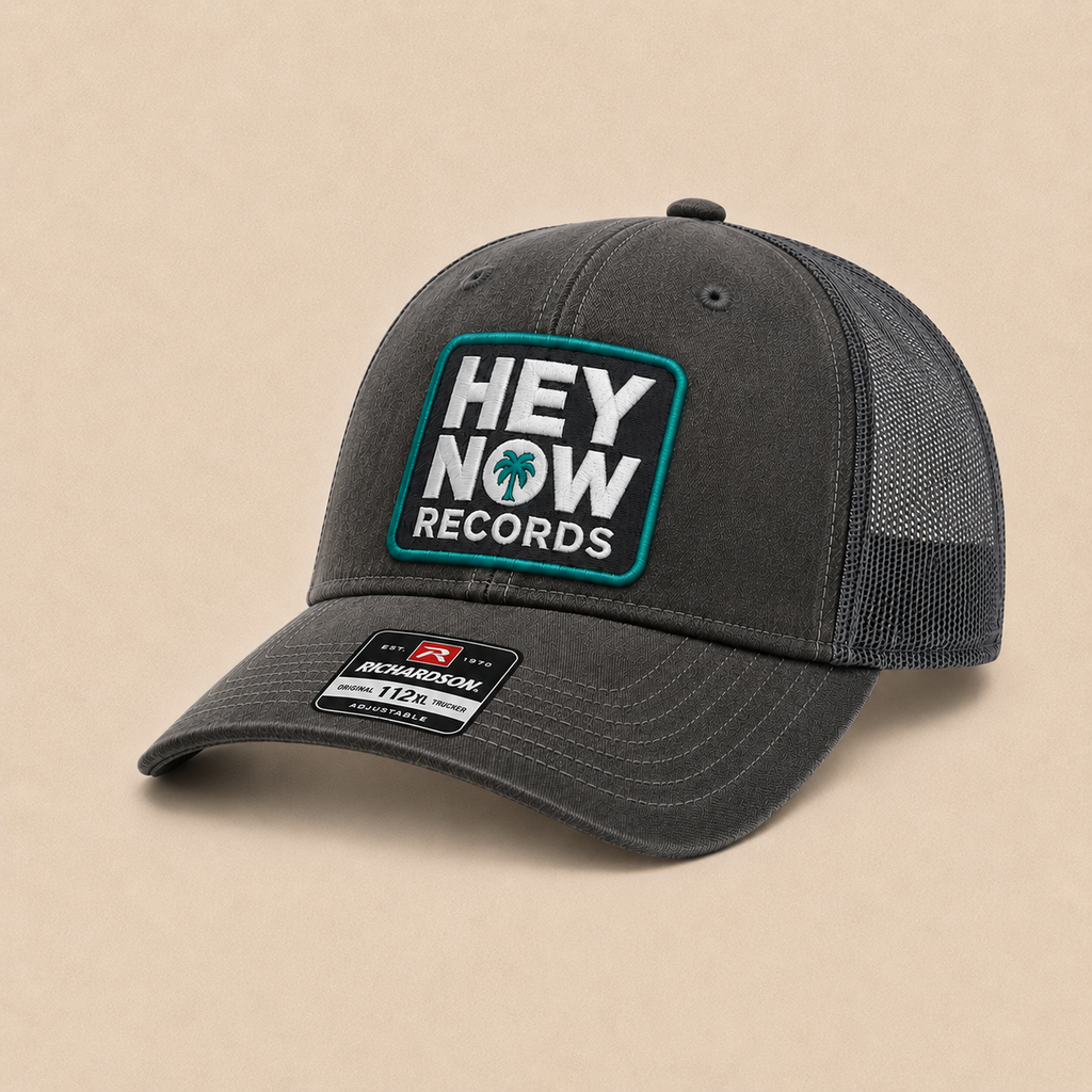 HEY NOW Square Logo Trucker Hat FRONT